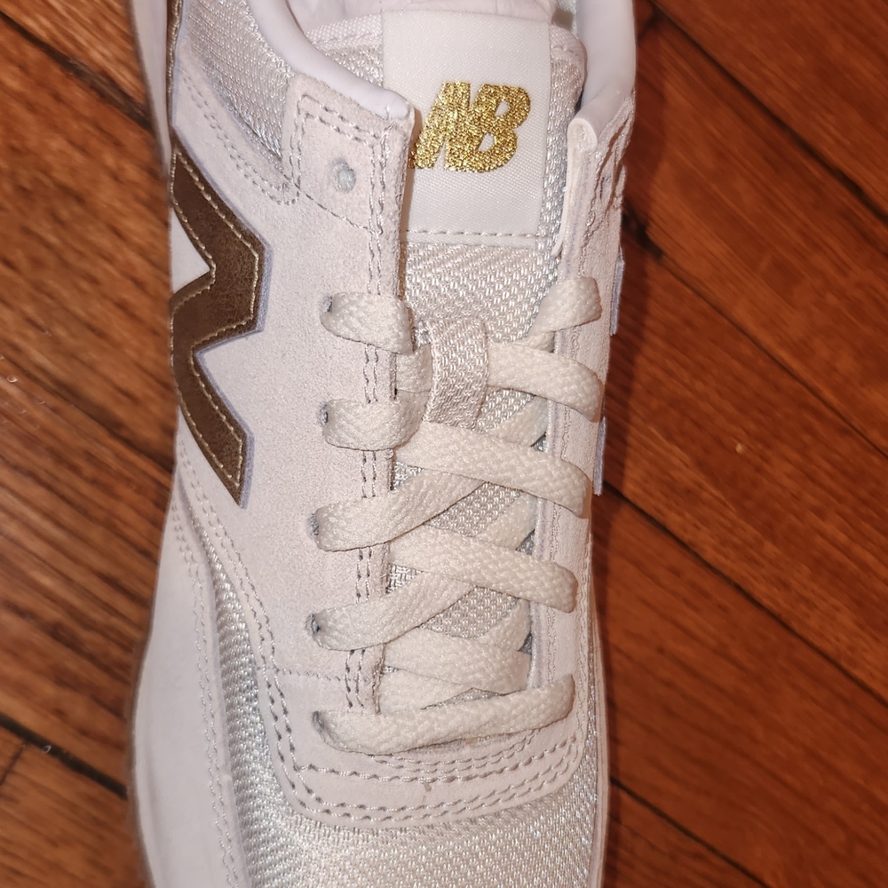New Balance White Sneakers with Gold Details